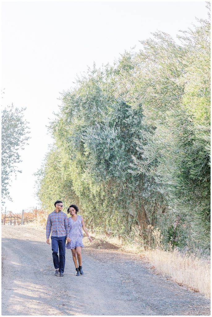 couple walking down unpaved road at Terra Mia Paso Robels