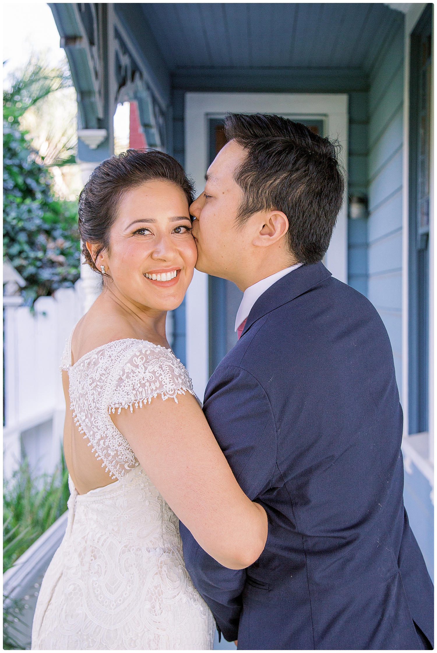 Groom kissing bride on the cheek by San Luis Obispo Wedding Photographer-Renoda Campbell Photography
