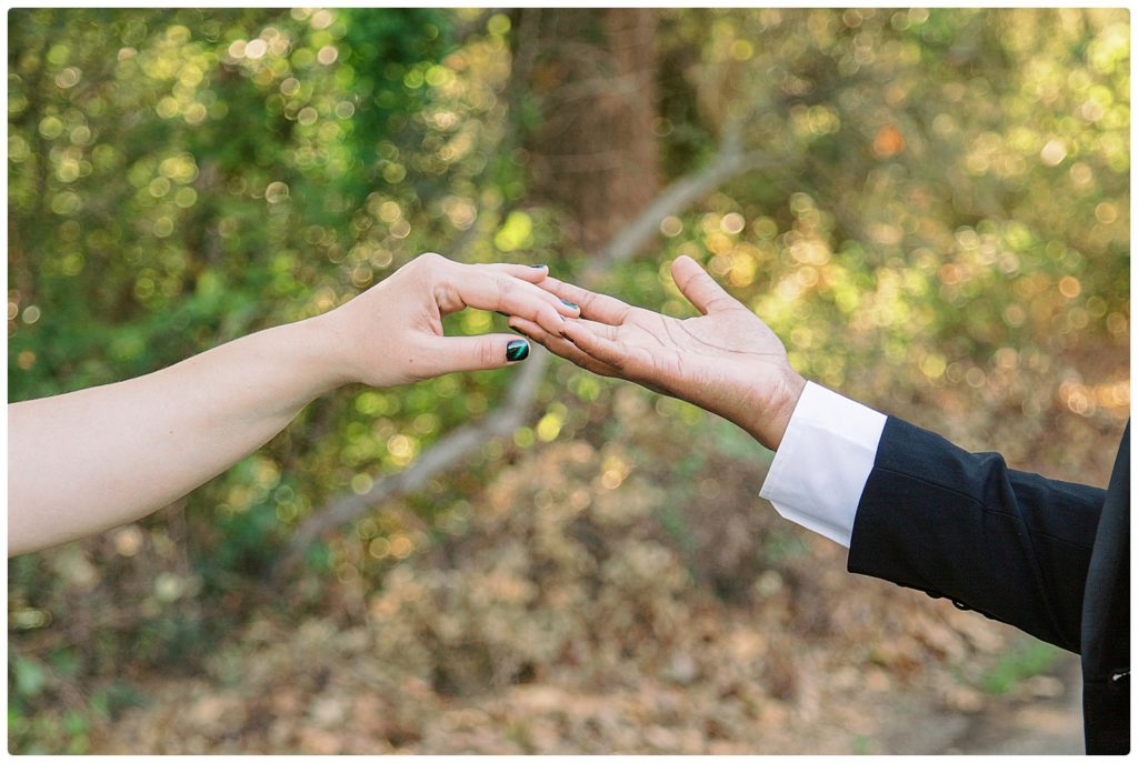 wedding couple's fingers lightly touching