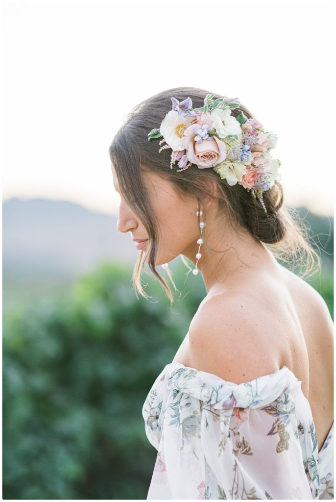 bride wearing floral headpiece - side photo