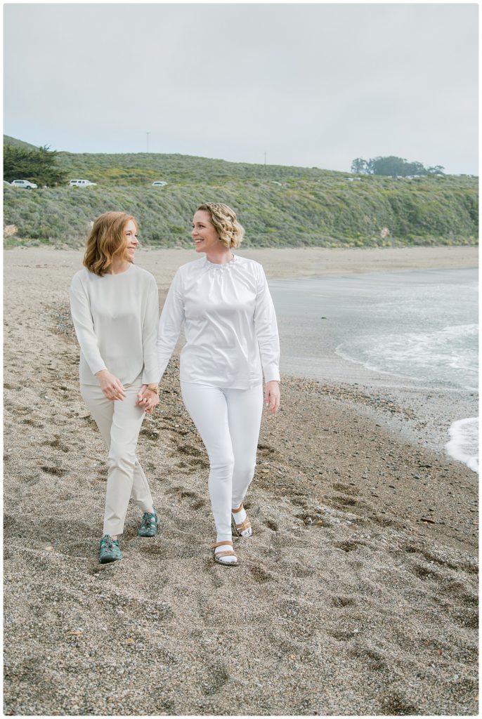Two women holding hands during LGBTQ wedding photography session in Los Osos, CA
