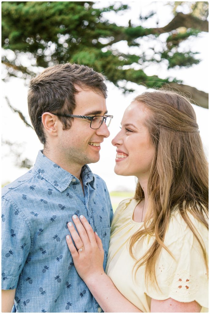 engaged couple looking into each other eyes. female has hand on male's chest during engagement session in San Luis Obispo, CA