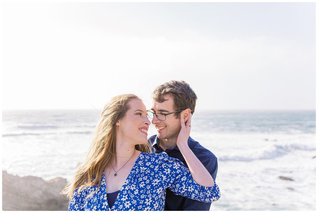 close up of engaged couple on ocean cliffs of montana del oro