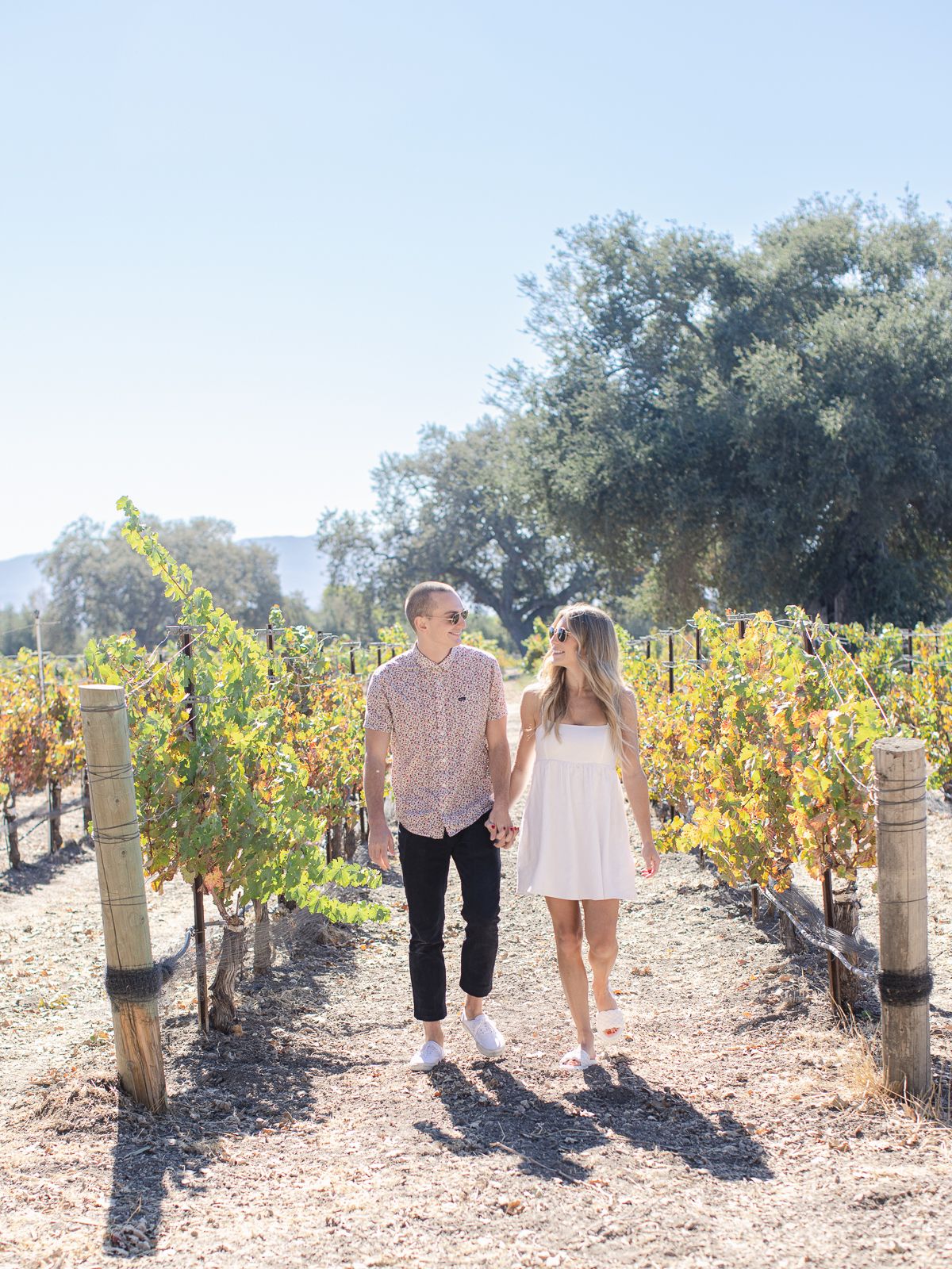 couple walking in winery