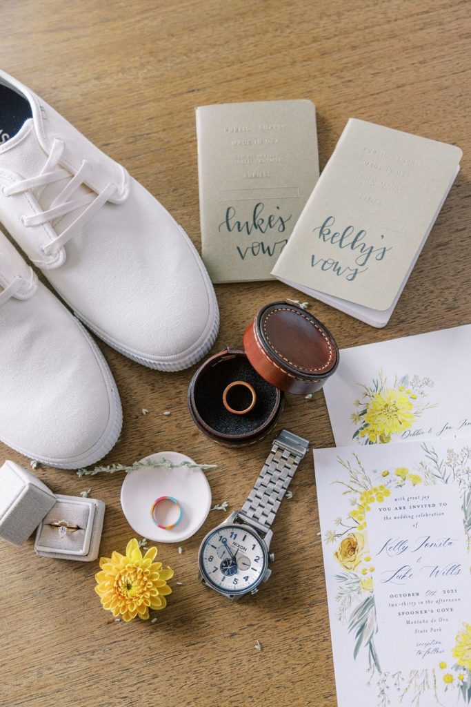 details of the boho wedding including rings, watches, shoes, vow books, and invitation