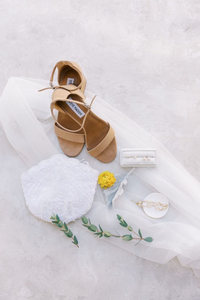 bridal details - bracelet, earrings, shoes, veil and beaded bag