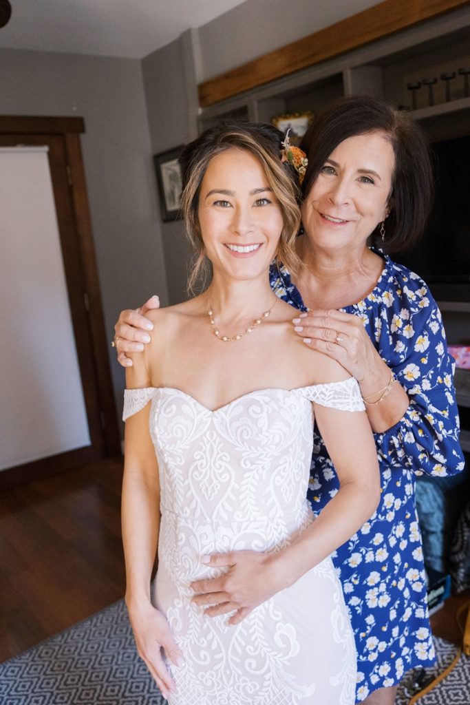 Mom with bride in her boho wedding gown